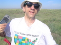 #8: Joseph Kerski at the 37 North 100 confluence point with geographic shirt.