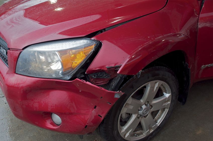 My car's smashed fender, after hitting a deer after leaving the confluence point.