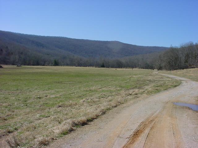 The confluence is located near the summit of the far ridge well up the valley in the top right of the photo.