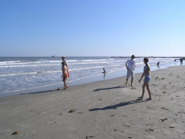 Playing on the beach, looking towards the point