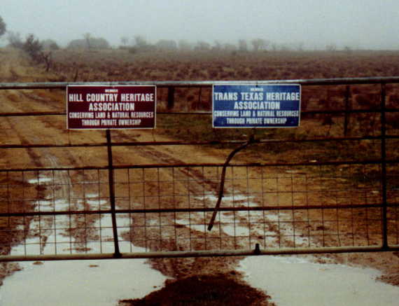 The locked gate indicating that the site is private property.