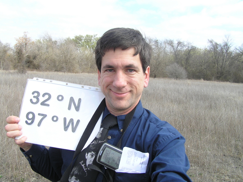 Joseph Kerski standing on the confluence with the eastern edge of the field in the distance.