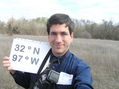 #2: Joseph Kerski standing on the confluence with the eastern edge of the field in the distance.