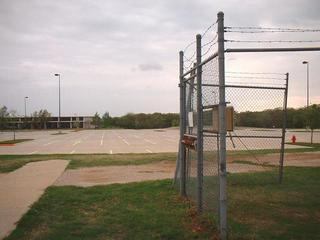 #1: A parking lot behind the building as seen from the confluence.