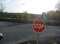 #10: Signage at Broken Road near parking spot, looking towards confluence