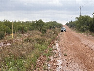 #10: A familiar sight:  My vehicle on a lonely road.  Nearest road to the confluence, to the south of the point.