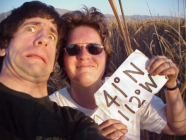 Joseph Kerski and Shannon White in the salt marsh; hand self portrait; no solid ground to set a tripod on!