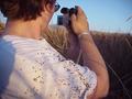 #7: Burrs cling to Shannon White as she documents the event for her media technology class.