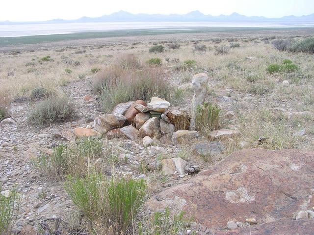 The confluence point is marked by a cairn (covering a geocache)