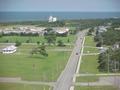#2: View east from the lighthouse; longitude 76 crosses the road just ahead of the farthest car on the road.