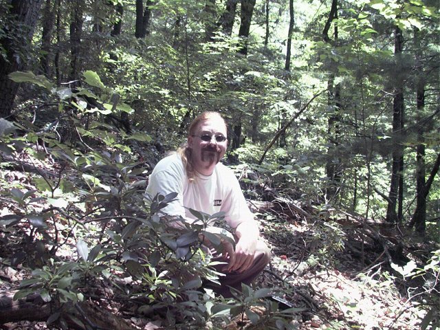 Me, crouching on the confluence.