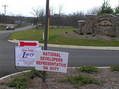 #8: View of the entrance to the housing development being built on the confluence.  The sign is 200 m south of the confluence.