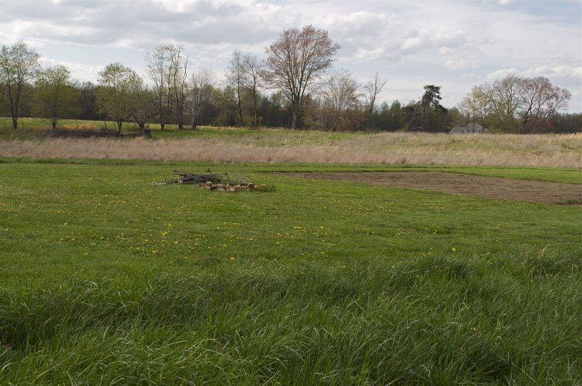 The confluence point is 70 feet away, near the back of the landscaped lawn shown here