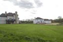 #5: View West.  The house on the left came first; the house on the right is very recent.