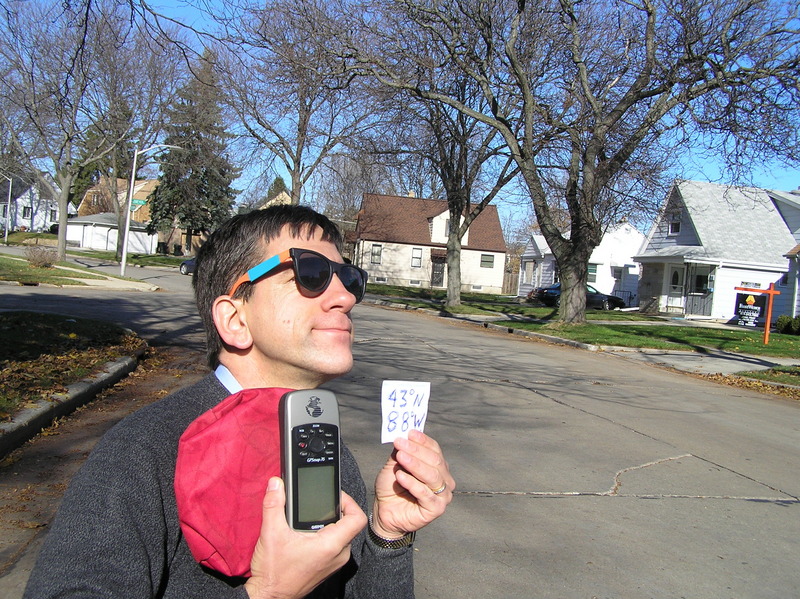 Joseph Kerski with confluence in the background.