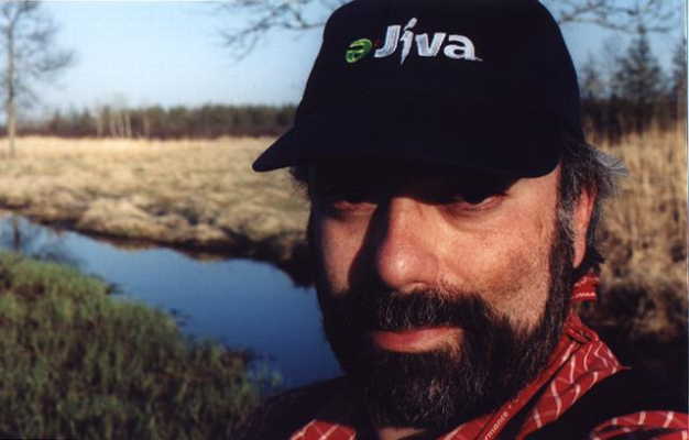 A self-portrait, with the confluence behind me, and the adjacent wetlands to my right