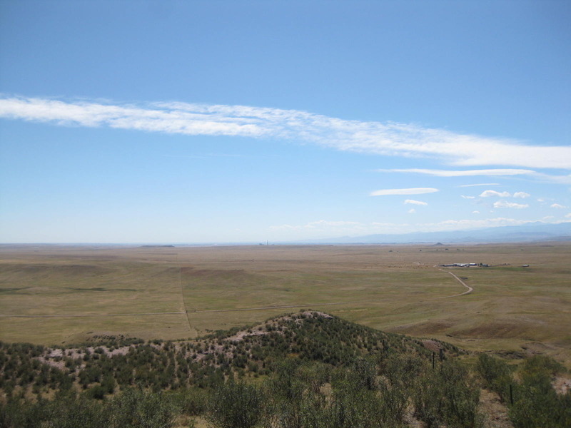 Looking south along the fenceline from the top of the butte. You can see the road to the ranch manager's residence and even the smokestack due south