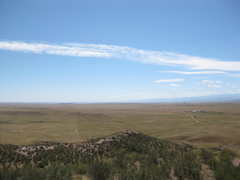 Looking south along the fenceline from the top of the butte. You can see the road to the ranch manager's residence and even the smokestack due south
