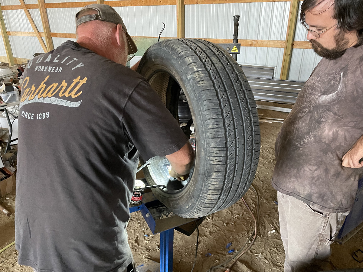 Adventures in tire patching, Medicine Bow, Wyoming