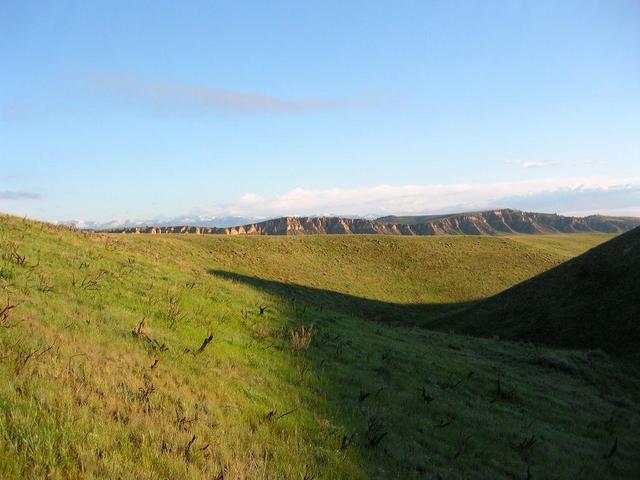 Looking North from site toward Absoroka Mountains and foothills.  Sunshine Reservoir lies on the other side of middle hill/ridge; Wood River runs below steep ridge.