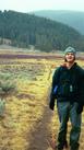 #3: Standing along the trail (trailhead and vehicle in the distant background).