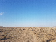 #2: North-East: irrigation lake, dry riverbanks, road at the horizon