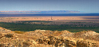 #10: there once was water: drilling rig in front of leftover of Aral Sea and west escarpment called "Chink"