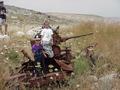 #4: Tal and Omer sitting on an old cannon, Tsvika on the left