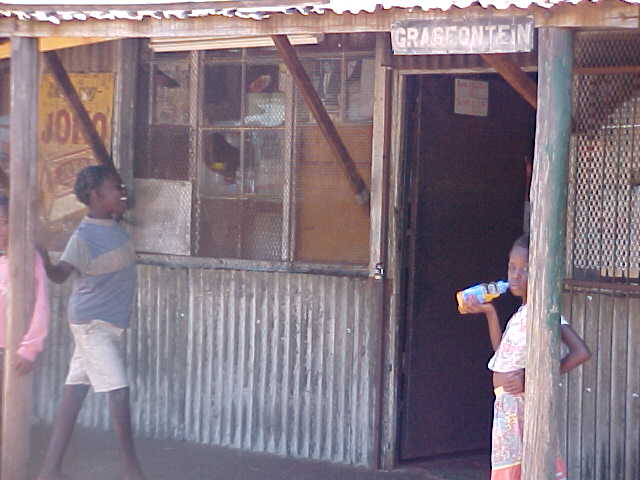 Grasfontein General store with two children