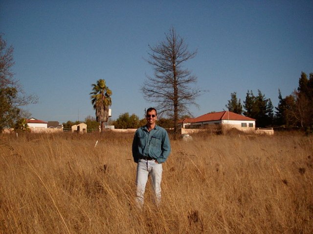 Looking south. Housing development entrance visible. Willem Fourie enjoying some sun.