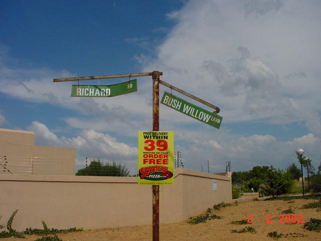 Shows the street junction right at the entrance.