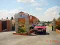 #3: View of the entrance to the housing development, about 100 metres south of the Confluence.