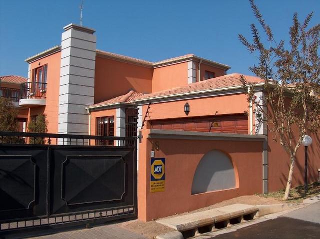 Entrance gate for no.18 with garage in view