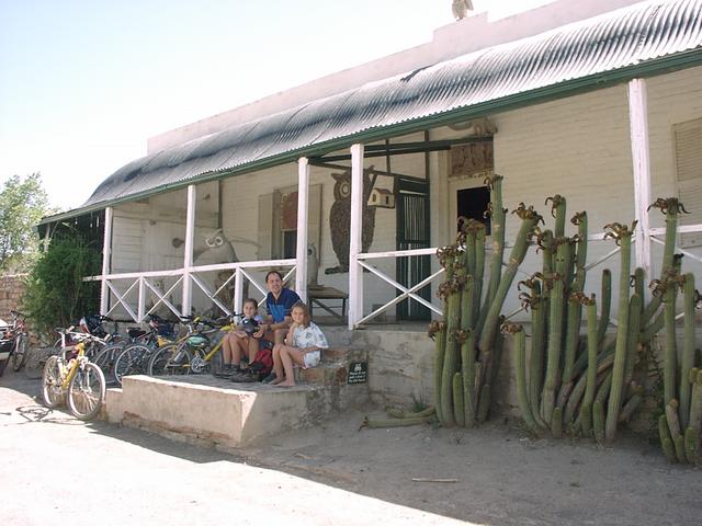 Me and two of my kids in front of the Owl house