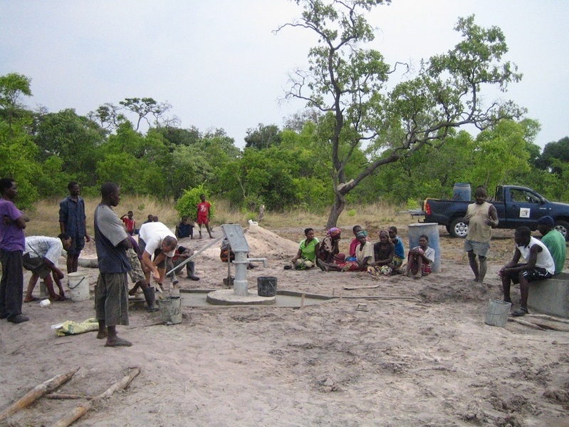 Project completion. Explaining to the villagers how to keep their well clean and hygienic