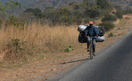 #10: A common sight on the highway - transporting charcoal with bicycle