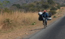 #10: A common sight on the highway - transporting charcoal with bicycle